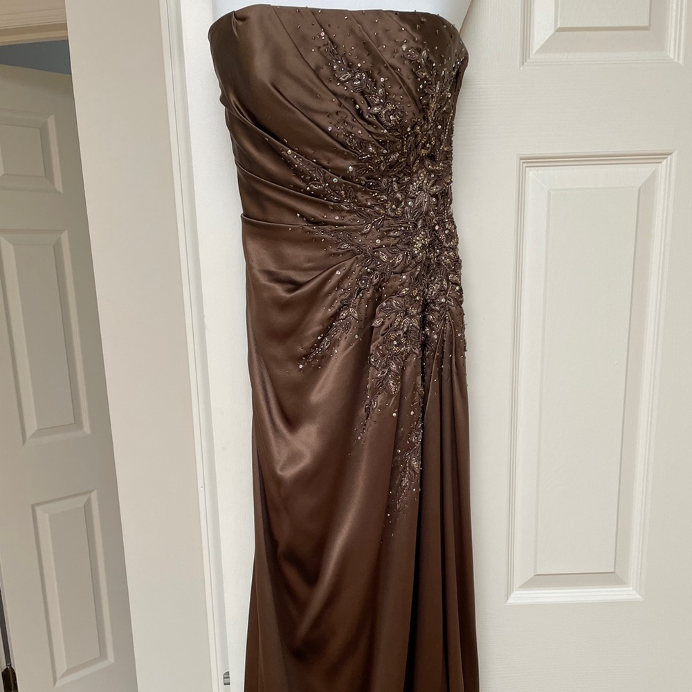 Beautiful gown with beading and ruching detail. Only worn once!